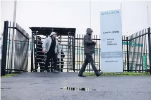  ?? Picture: Adrian White ?? Workers leaving the Schaeffler (UK) factory in Bynea.