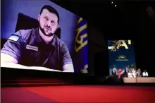  ?? Pascal Le Segretain/Getty Images ?? Ukrainian President Volodymyr Zelenskyy speaks via video during the opening ceremony for the 75th annual Cannes Film Festival on Tuesday at Palais des Festivals in France.