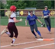  ?? JOHN KAMPF — THE NEWS-HERALD ?? Lauren Riccobelli of Gilmour steps on first base to record an out during the Lancers’ D-III district final loss to South Range on May 19.