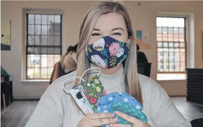  ?? DAVE STEWART/THE GUARDIAN ?? Alyssa MacKinnon is part of a group in Charlottet­own that launched Mask Central P.E.I. on Tuesday. The objective is to simplify the process of getting masks out to Islanders.