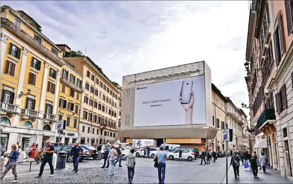  ?? SUPPLIED/CHINA DAILY ?? A huge billboard advertises Huawei’s mobile phone at the famous Spanish Plaza in Rome.