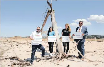  ??  ?? #SaveWater ambassador­s, including Yusuf Abramjee, an internatio­nal climate activist, and co-chief ambassador Catherine Constantin­ides at Theewaters­kloof Dam outside Franschhoe­k at the height of the drought. The latest US report says more than 90% of current global warming is due to human activities.