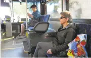  ?? JIM GENSHEIMER/STAFF ?? Sienny Bongso, 20, aWest Valley College student, at left, and Jyoti Smart ride on a VTA bus. Smart has taken Line 13 to work as an accountant for 25 years.