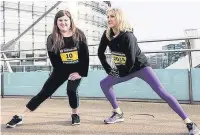  ??  ?? ●● Sally O’Shea from Didsbury and Paula Radcliffe limbering up at Salford Quays