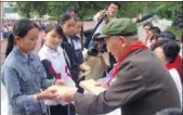  ?? PHOTOS PROVIDED TO CHINA DAILY ?? Red Army veteran Li Guang visits schools and gives lectures to tell young people his stories of the Long March.