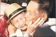  ?? Lee Ji-eun / Associated Press ?? South Korean Lee Keum-seom, 92, left, weeps with her North Korean son Ri Sang Chol, 71, during the Separated Family Reunion Meeting at the Diamond Mountain resort in North Korea on Monday. Dozens of elderly South Koreans crossed the heavily fortified border into North Korea on Monday for heart-wrenching meetings with relatives most have not seen since they were separated by the turmoil of the Korean War.