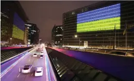  ?? Photograph: Anadolu Agency/Getty Images ?? The Ukrainian flag illuminate­s the EU Commission, European Council and European Parliament buildings in Brussels to mark the anniversar­y of the war on 23 February, 2023.