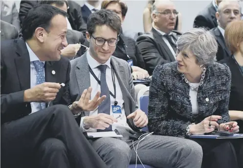  ??  ?? Leo Varadkar, left, and Theresa May talk ahead of a session at the European Social Summit in Gothenburg, Sweden yesterday