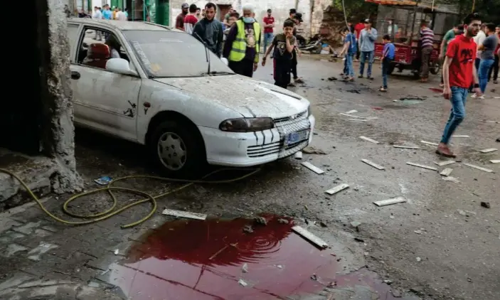  ??  ?? The scene in the northern Gaza Strip after Israeli airstrikes. The Gaza health ministry said nine Palestinia­ns were killed. Photograph: Mohammed Salem/Reuters