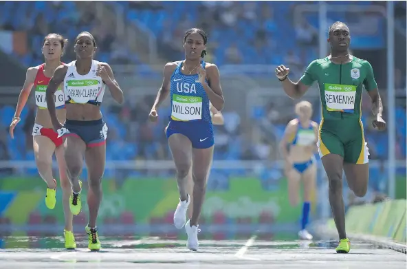  ?? — GETTY IMAGES ?? South Africa’s Caster Semenya, right, won her women’s 800-metre heat Wednesday morning in a time of 1:59.31. She’ll race in the semifinals Friday night, with hopes of qualifying for the finals set to take place Saturday night at Olympic Stadium in Rio de Janeiro.