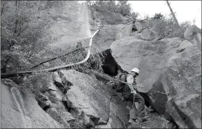  ?? ASSOCIATED PRESS ?? THIS UNDATED PHOTO PROVIDED BY the National Park Service shows water spraying from a break in an exposed section of the Grand Canyon trans-canyon waterline as a worker attempts repairs. Park officials plan to replace at least part of the decades-old...