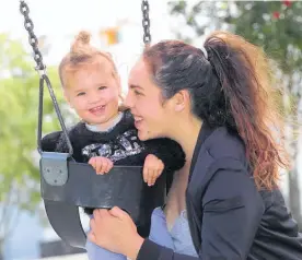  ?? Photo / John Stone ?? Porsha Hills, 1, and mum Marie Shelford enjoy the fine weather at the Whanga¯rei Town Basin playground.