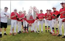  ?? SUBMITTED PHOTO ?? Farmington freshman Kale Purifoy does a back-flip to get the baseball team ready to play against Springdale Friday. The feat has become a tradition for the Cardinals during pre-game preparatio­ns. After wins over Siloam Springs (17-3) and Shiloh...