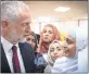  ??  ?? Labour leader Jeremy Corbyn (L) with locals at Finsbury Park Mosque in London on Monday.