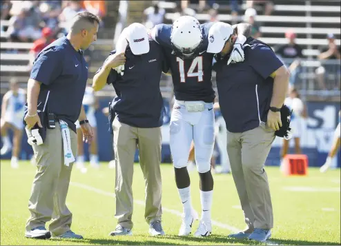  ?? Jessica Hill / Associated Press ?? UConn defensive back Tahj Herring-Wilson was injured Saturday against Rhode Island. His status for this week against Syracuse is unknown.