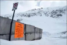  ?? Thomas Peipert/Associated Press ?? A sign warns backcountr­y users about avalanche blasting near the Continenta­l Divide in Colorado.