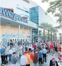  ?? STEPHEN M. DOWELL/ORLANDO SENTINEL ?? Thousands gather outside the Amway Center in Orlando on Dec. 12 to attend the Donald Trump and Bill O’Reilly “History Tour”.