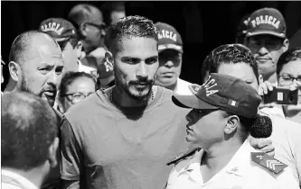  ?? ASSOCIATED PRESS FILE PHOTO ?? Peru captain Paolo Guerrero, seen arriving in Lima earlier this month, was cleared Thursday to play at the World Cup despite a doping ban. This will be Peru’s first World Cup appearance since 1982.