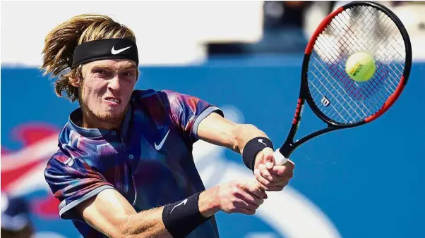  ?? — AFP ?? New kid on the block: Russia’s Andrey Rublev returning the ball to Belgium’s David Goffin during their fourth round match on Monday.