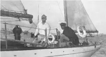  ??  ?? Olin Stephens (standing) at the helm of his 1931 transatlan­tic winning yacht Dorade