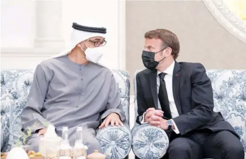  ?? ?? Mohamed Bin Zayed with Emmanuel Macron in Abu Dhabi on Sunday.