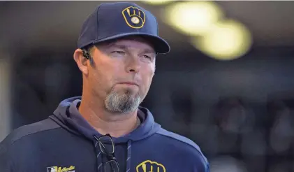  ?? MILWAUKEE JOURNAL SENTINEL FILES ?? Milwaukee Brewers pitching coach Chris Hook looks on in the dugout during a game in 2019.