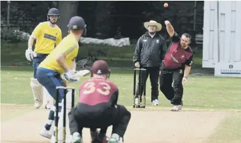  ??  ?? Philadelph­ia’s Shaun Hauxwell bowling to Whitburn’s Thompson.