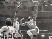  ?? AP FILE ?? Bob Lanier, who has the most points in Pistons history, shoots over the 76ers’ Darryl Dawkins in 1977.