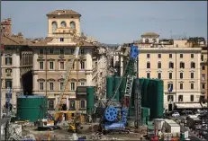  ?? (AP/Alessandra Tarantino) ?? Work continues at the site of a major undergroun­d hub in central Piazza Venezia in Rome on Thursday. Work between the central Piazza Venezia and the boulevard to the Colosseum is expected to last at least four years, long after Jubilee 2025 concludes.