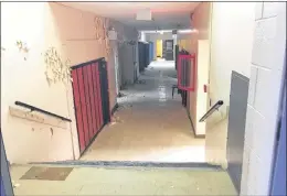  ?? BARB SWEET/THE TELEGRAM ?? The telltale signs of abandonmen­t are seen in a hallway at the former Booth Memorial High School in St. John’s.