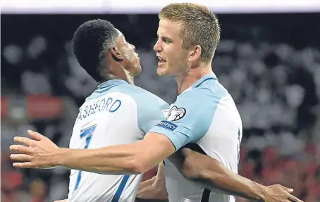 ?? Picture: Getty. ?? Goal heroes Marcus Rashford and Eric Dier celebrate England’s crucial win over Slovakia.