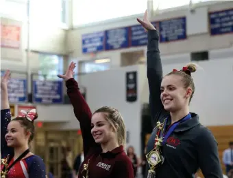  ??  ?? ON THE PODIUM: Masconomet’s Gracy Mowers, right, took home first place, while Algonquin’s Elizabeth Debroczy won second place and Bridgewate­r-Raynham/West Bridgewate­r standout Olivia Keyes won third.