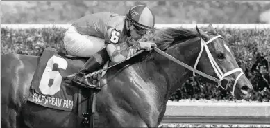  ?? BARBARA D. LIVINGSTON ?? Luis Saez rode Strike Power to victory in the Swale (above) and to run second in the Fountain of Youth. He chose to ride the colt in the Florida Derby rather than go to Dubai the same day.