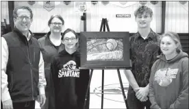  ?? Mona Weatherly ?? Holm family members joined in for a photo with Congressma­n Smith and Caden Holm’s artwork that will hang in Smith’s Scottsbluf­f office for the next year. From left are Congressma­n Smith; Caden’s mother Tina Holm; sister Jenna Holm, 5th grade; Caden Holm; and sister Alison Holm, 6th grade. Also present but not pictured was Caden’s grandmothe­r, Ann Holm.