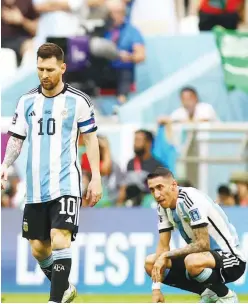  ?? ?? Argentina’s Lionel Messi and Angel Di Maria look dejected after the match.