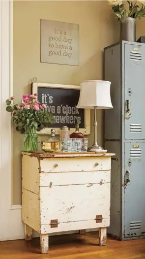  ??  ?? "It was built for a different style of living, so we wanted to open up the kitchen, make abigger family room and create outdoor living.” Another flea-market find, Leslie repurposed this small vintage cabinet to serve as a farmhouse-style bar cart.