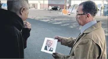  ??  ?? L.A. CITY COUNCIL President Herb Wesson, who is running for county supervisor, is shown in an image from a campaign ad in which he searches skid row for his homeless son, Doug, whose photo he holds.