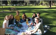  ??  ?? French and American students enjoy a picnic at Todd Grove Park.