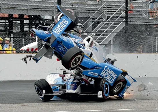  ??  ?? Scott Dixon launches into the air in what was the start of his horrific Indy 500 crash in 2017.