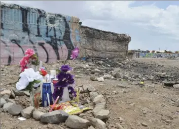  ?? PHOTO JULIO MORALES ?? A makeshift memorial has been erected where 24-year-old El Centro resident Erasmo Chris Torres was fatally shot early Sunday near Hamilton Avenue and the railroad tracks.