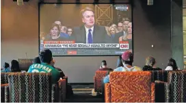  ?? [AP PHOTO] ?? Dozens of college students at Arizona State University in Phoenix watch the Senate Judiciary Committee hearing of Supreme Court nominee Brett Kavanaugh as he testifies on Thursday.