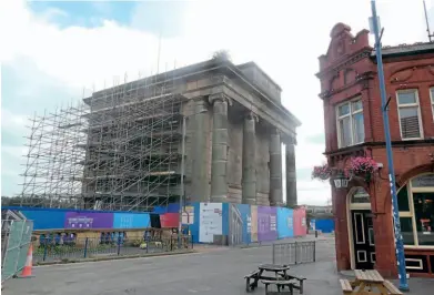  ?? ROBIN JONES ?? Right: Scaffoldin­g in place as the project to restore Birmingham’s Old Curzon Street station began on September 2 as part of the city’s HS2 terminus. Opposite is the Woodman pub, which will also survive alongside the new station.