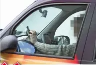  ??  ?? DIGITAL DISTRACTIO­N Most common offence we spotted was motorists using their mobiles and devices while behind the wheel