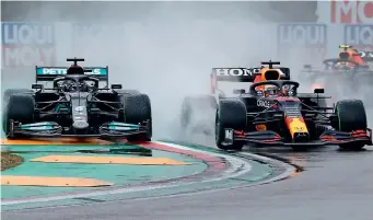  ?? Reuters ?? Red Bull’s Max Verstappen and Mercedes’ Lewis Hamilton in action during the race. —