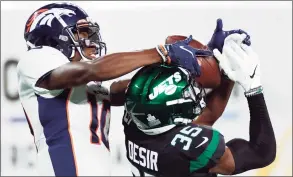  ?? Adam Hunger / Associated Press ?? Broncos wide receiver Jerry Jeudy (10) makes a catch over Jets cornerback Pierre Desir (35) on Thursday in East Rutherford, N.J.