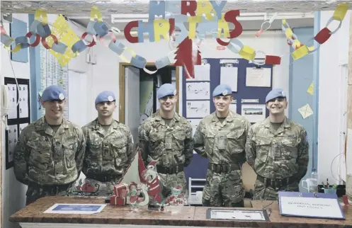  ??  ?? Soldiers from Royal Scot Dragoon Guards in Cyprus send a Christmas message home