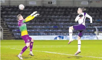  ?? - AFP photo ?? Bale shoots past Wycombe Wanderers’ English goalkeeper Ryan Allsop (left) to score their first goal.