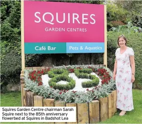  ?? ?? Squires Garden Centre chairman Sarah Squire next to the 85th anniversar­y flowerbed at Squires in Badshot Lea