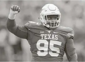  ?? Ronald Martinez / Getty Images ?? Poona Ford showed he could play well at defensive tackle despite his relative lack of height (5-11) by earning preseason All-Big 12 honors.