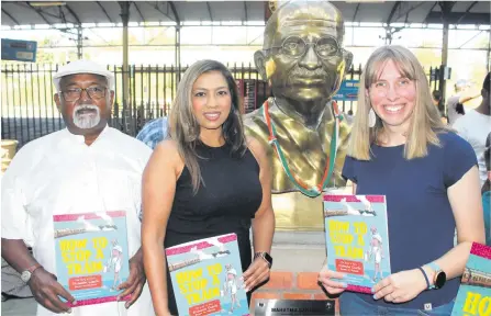  ?? Photo: Nqubeko Mbhele ?? David Gengan, Chairperso­n of the Gandhi Foundation, left, with authors Kathryn Pillay and Stephanie Ebert at the Pietermari­tzburg Railway Station for the launch of the children’s book How to Stop a Train: The Story of How Mohandas Gandhi Became the Mahatma.